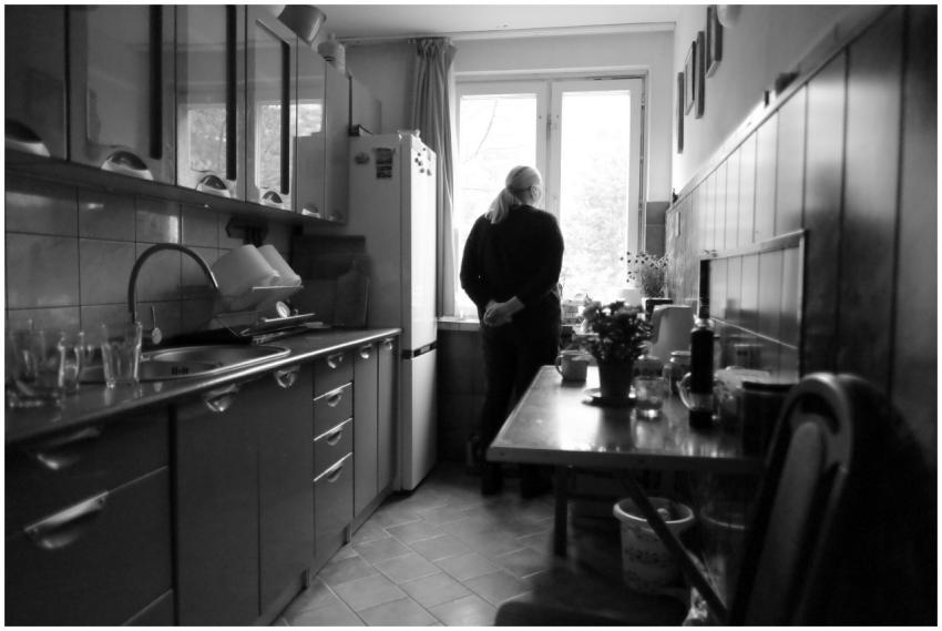 Black and white image of a person in a Polish kitc