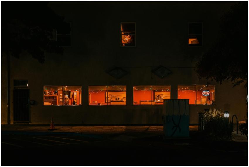 Warmly lit restaurant with string lights and open