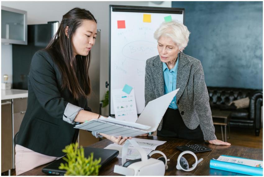 An Asian and a senior Caucasian woman engaged in a