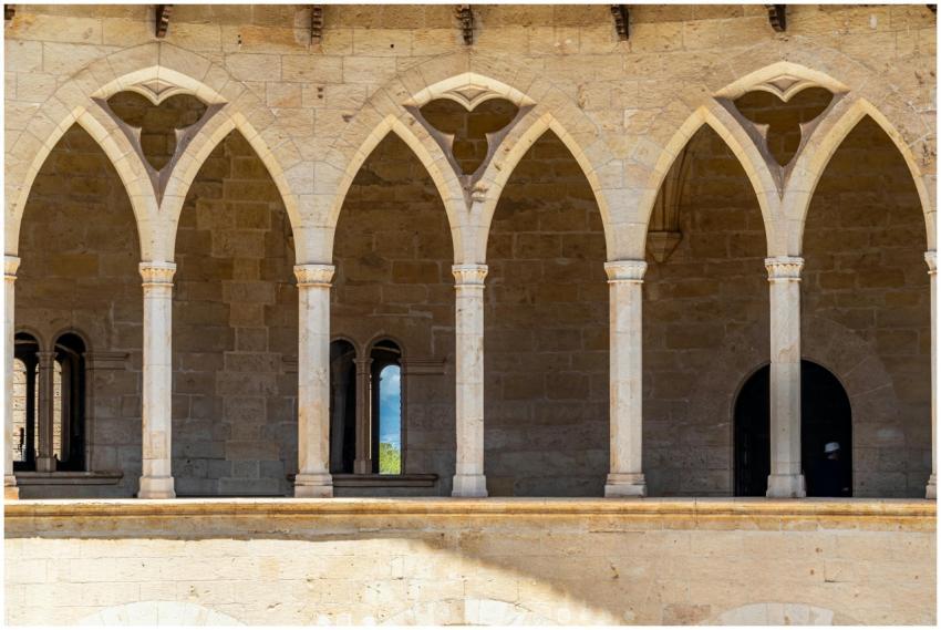 Stone gothic arches at Bellver Castle, a landmark