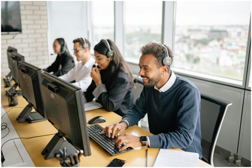 A diverse team of call center agents working toget