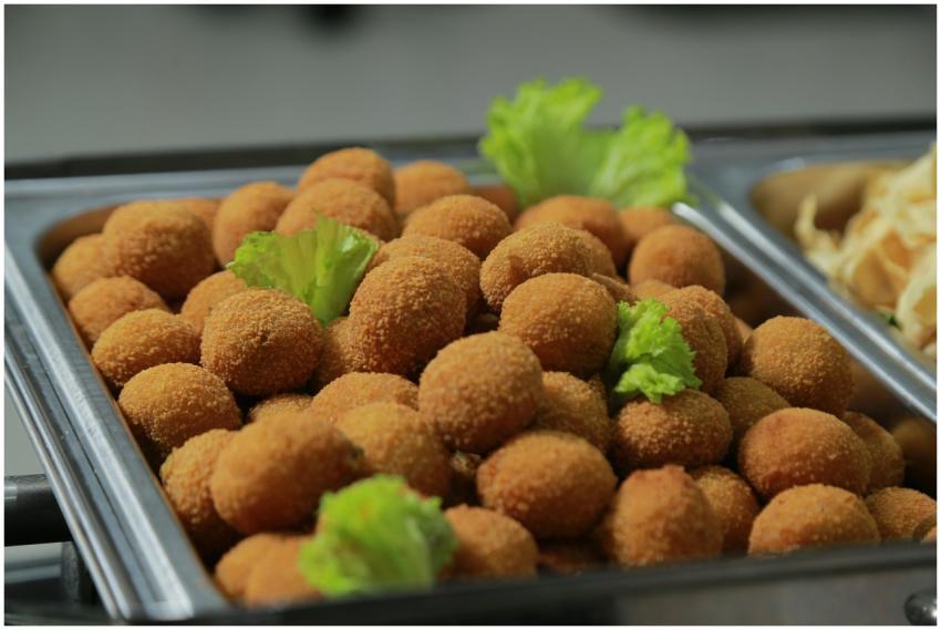 Delicious fried appetizers served on a metal tray,
