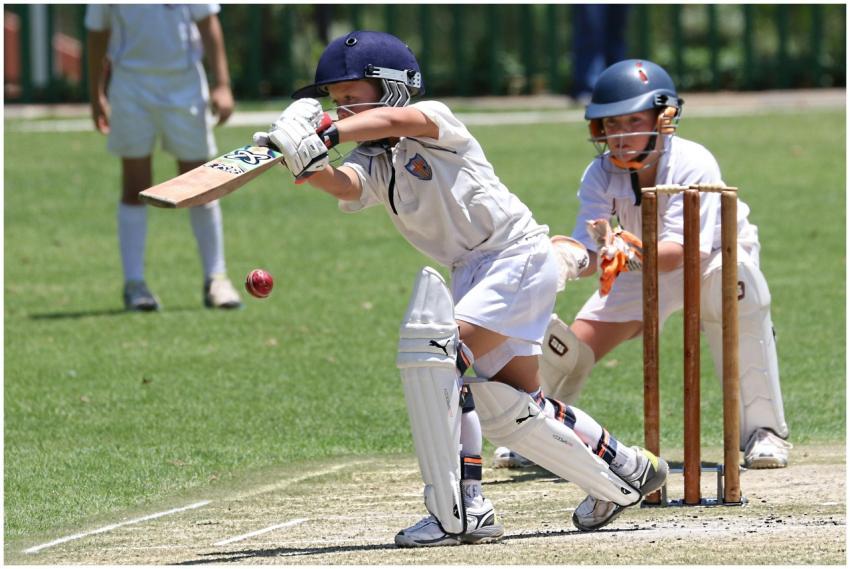 Young cricketers playing with focus and skill on a