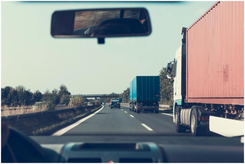 View through rearview mirror of trucks on a German