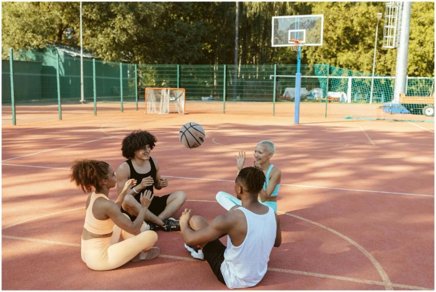 Group of friends having fun playing with a basketb