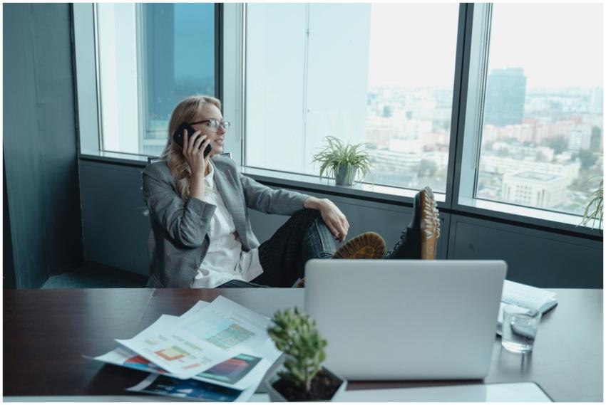 A confident businesswoman makes a phone call in a