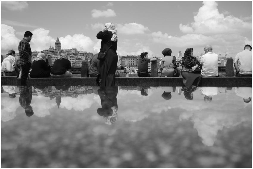 Black and white photo of people near Galata Tower,