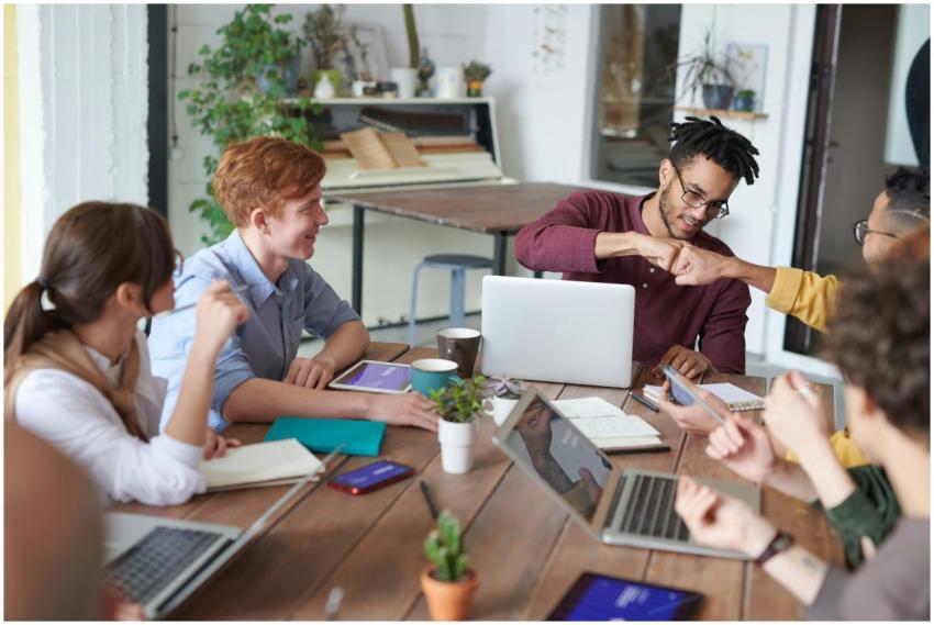 A diverse group of young professionals brainstormi
