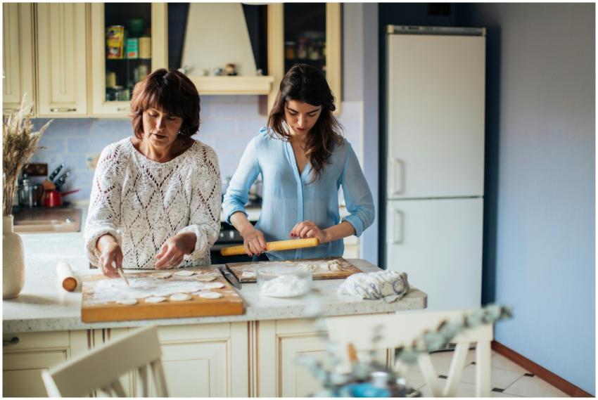 Mother and daughter making traditional Russian pel
