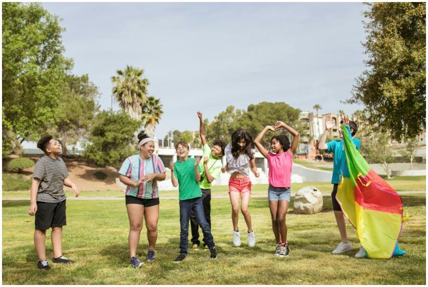 Group of diverse kids laughing and playing togethe