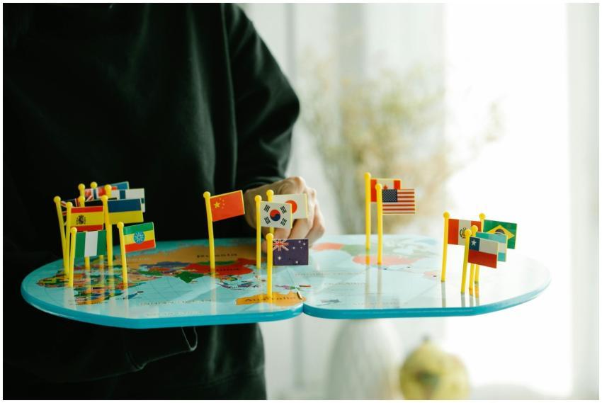 A vibrant world map with various miniature flags r