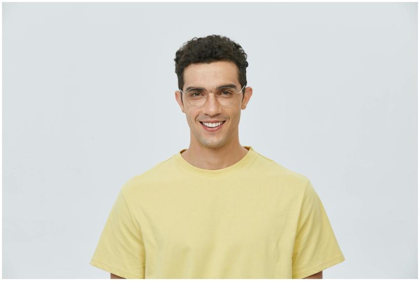 Portrait of a young man wearing glasses and a yell