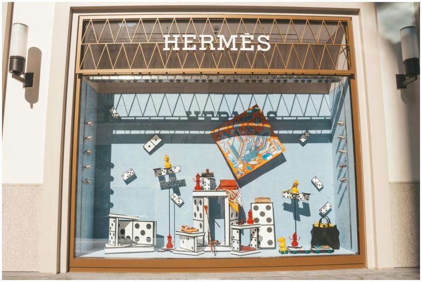 Artistic window display at a Hermes store featurin
