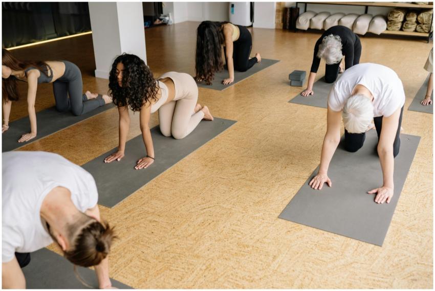 A diverse group practicing yoga in a studio, perfo