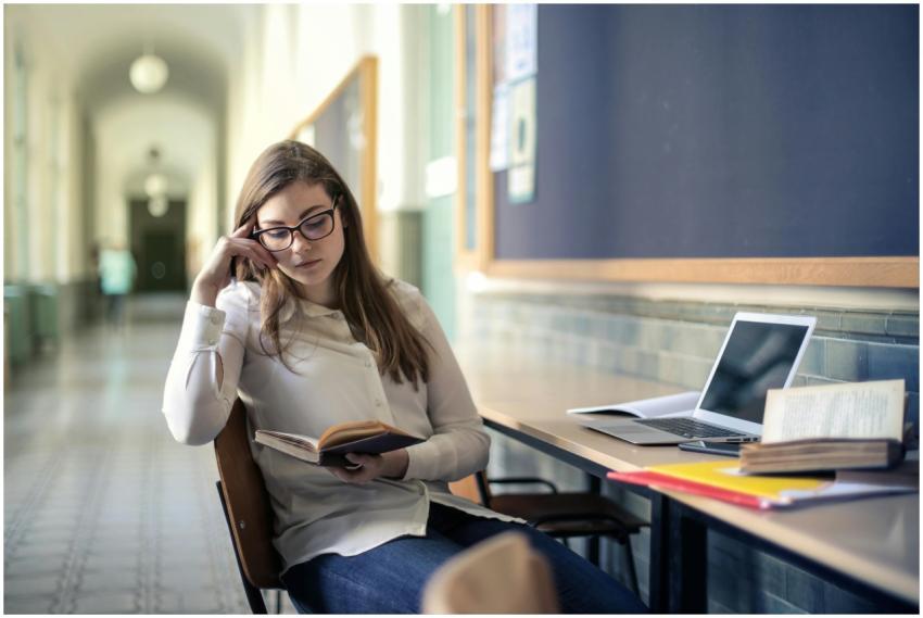 A young woman studies diligently in a university h