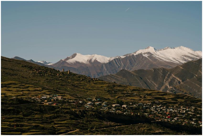 Picturesque village nestled in lush mountains unde