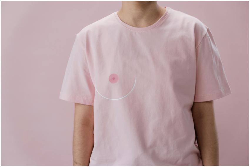 Close-up view of a person in a pink t-shirt promot