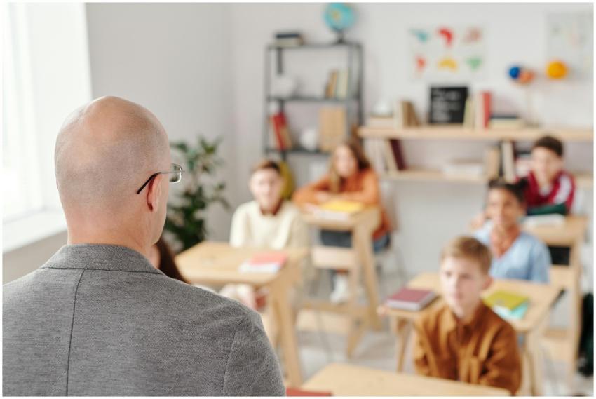 Teacher leading a classroom discussion with attent