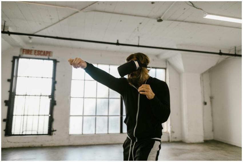 A man using virtual reality headset indoors, simul