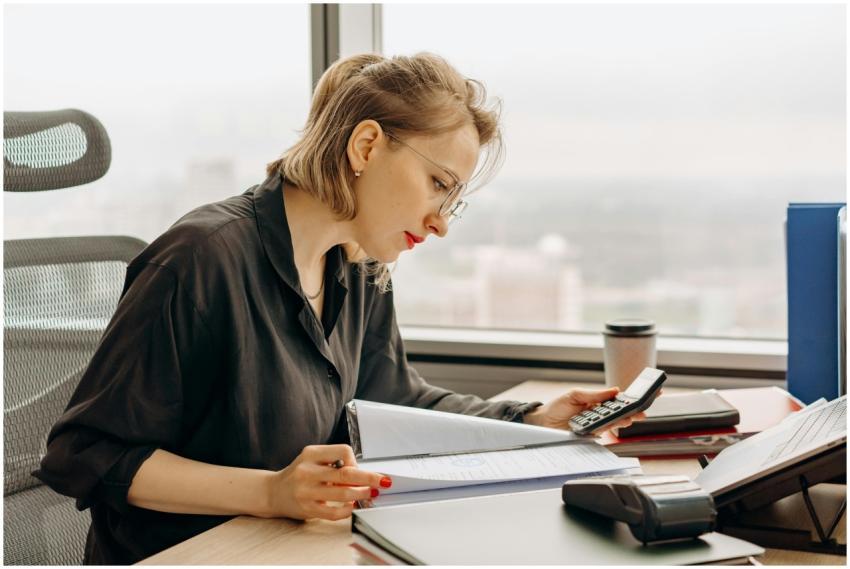 Woman accountant calculating financial documents a