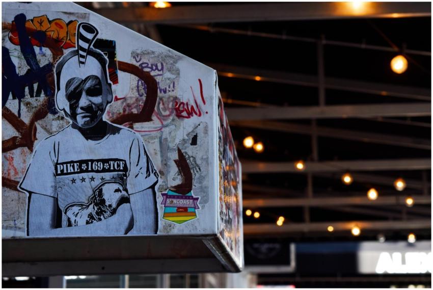 Street art featuring an abstract portrait and graf