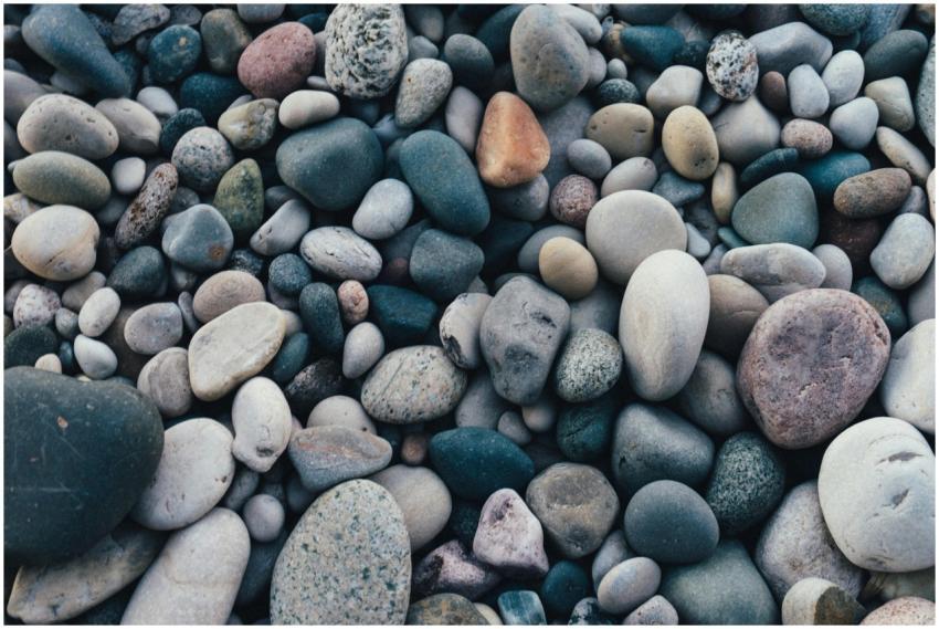A detailed view of smooth, multicolored pebbles cr
