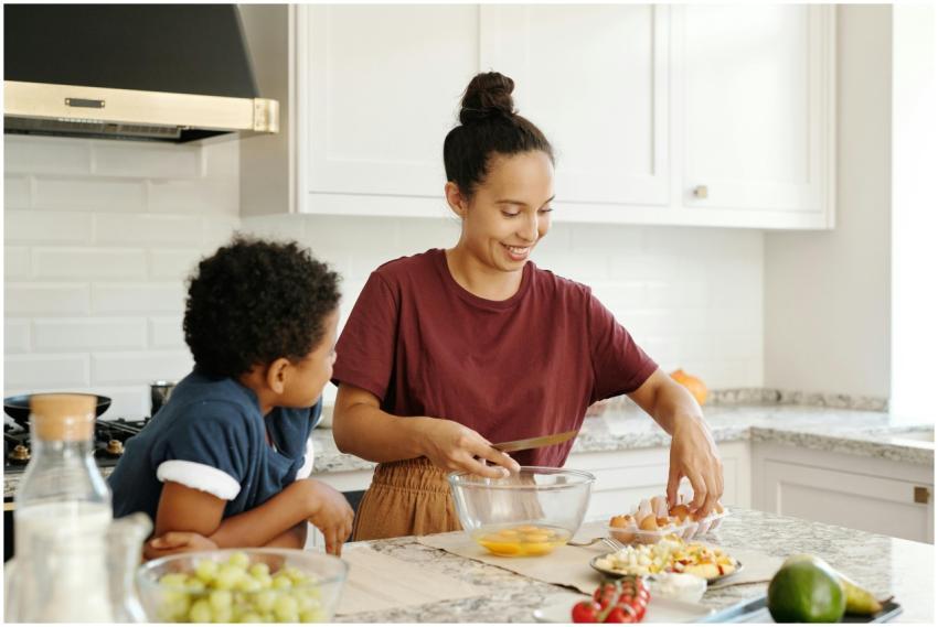 A mother and son enjoy cooking and bonding in a br