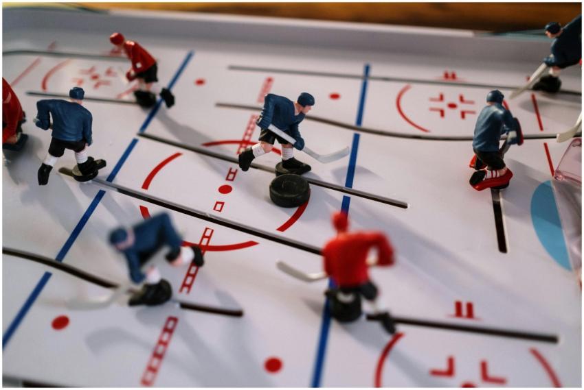 Closeup on a table hockey game showcasing figurine