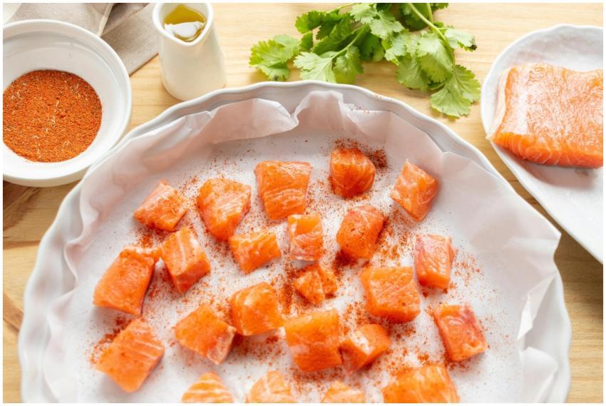 Fresh salmon cubes seasoned with spices ready for