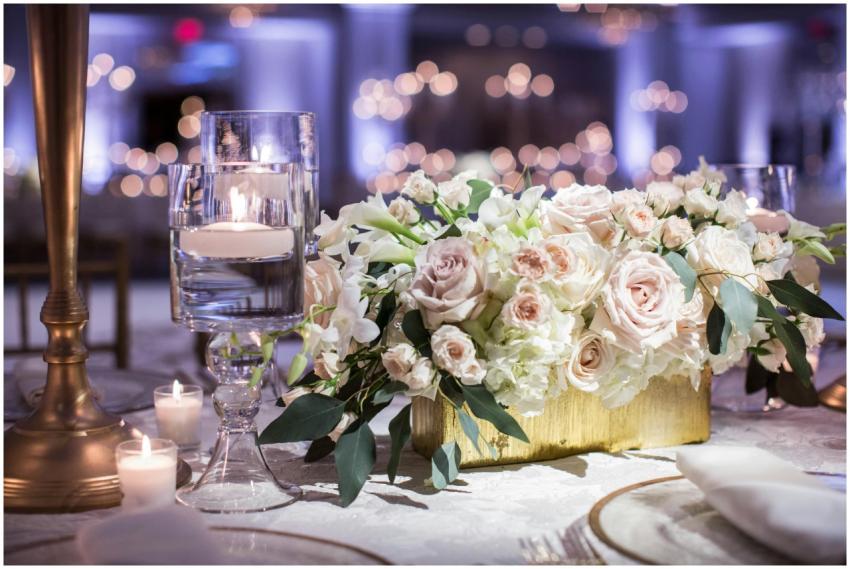 Luxurious wedding table setting with roses and can