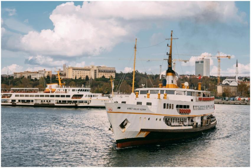 A passenger ferry navigating an urban waterway off
