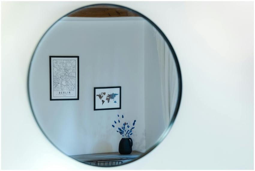 Stylish interior view of wall art and a vase of fl