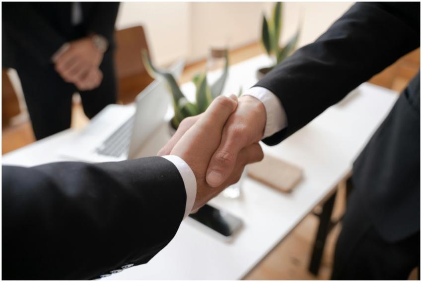 Close-up of a handshake between two professionals