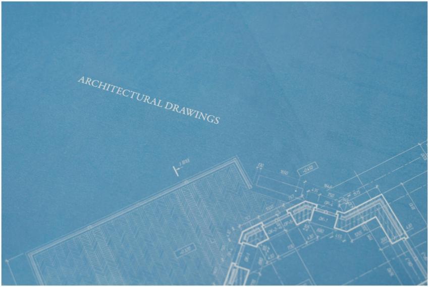 Close-up view of architectural blueprint with tech