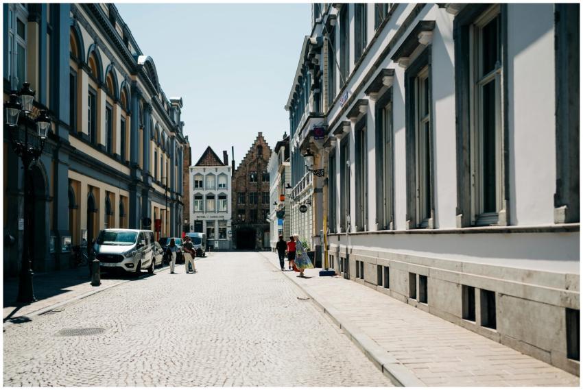 Cobblestone street in Bruges lined with historic t