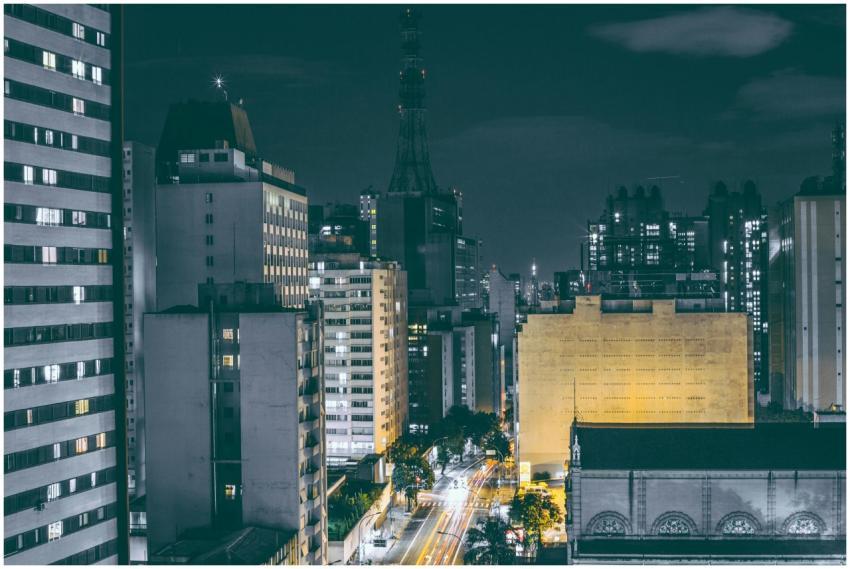 A vibrant cityscape at night with lit skyscrapers