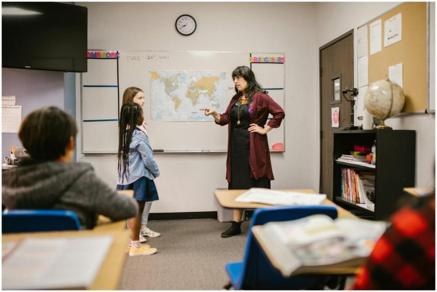 A teacher engaging with students during a classroo