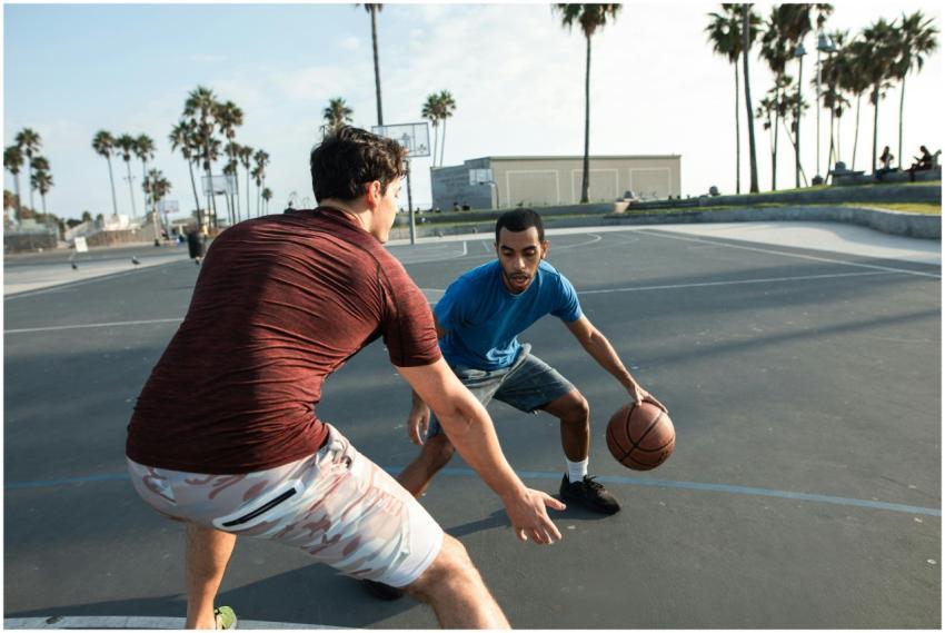 Action shot of two men in a basketball game on an