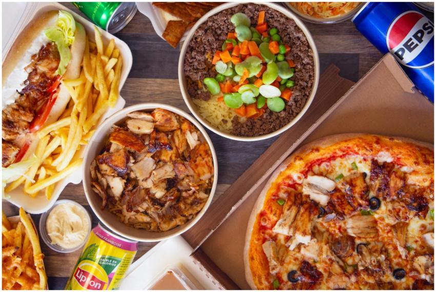 A variety of fast food items including pizza, sand