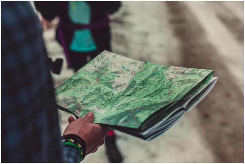 A close-up of a person holding a detailed route ma