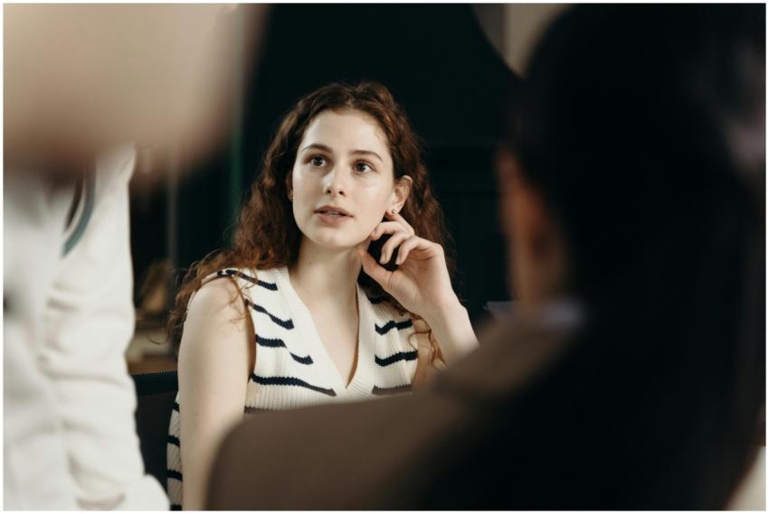 Young businesswoman attentively listening during a