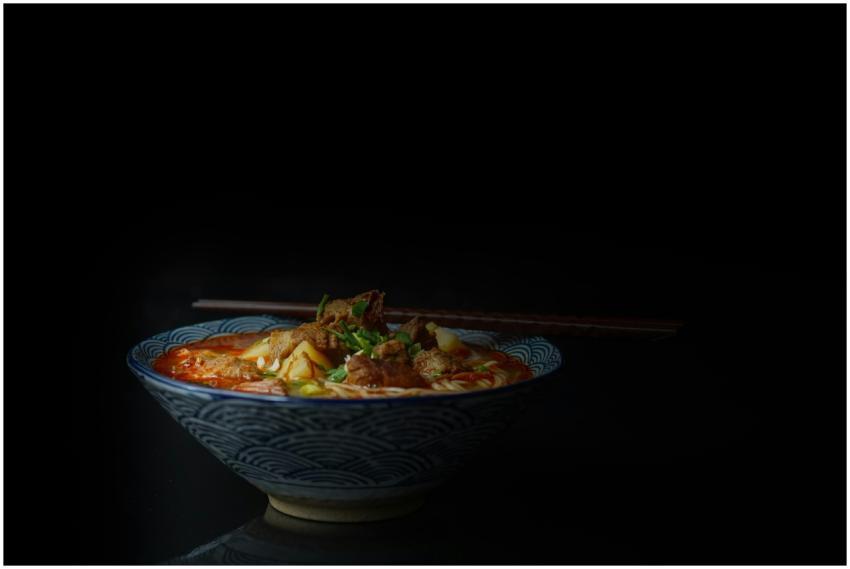 Close-up of a flavorful Asian noodle soup with mea