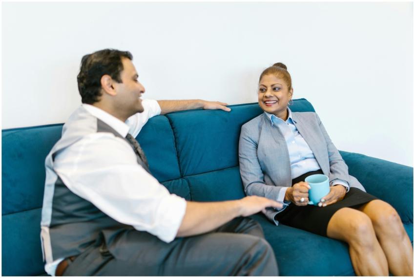 Two colleagues enjoying a coffee break on a blue s