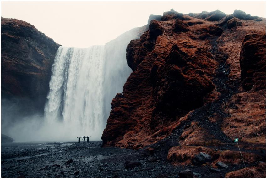 A group of adventurers stands before the majestic