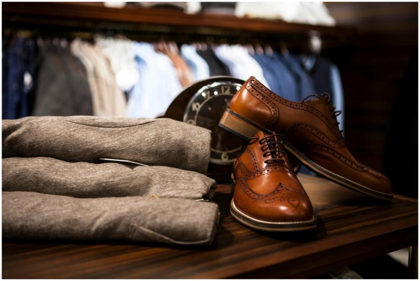 Stylish leather shoes displayed with gray clothing