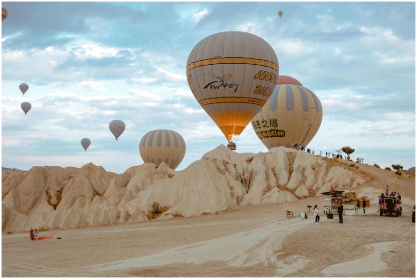 Hot air balloons soaring over the unique rock form