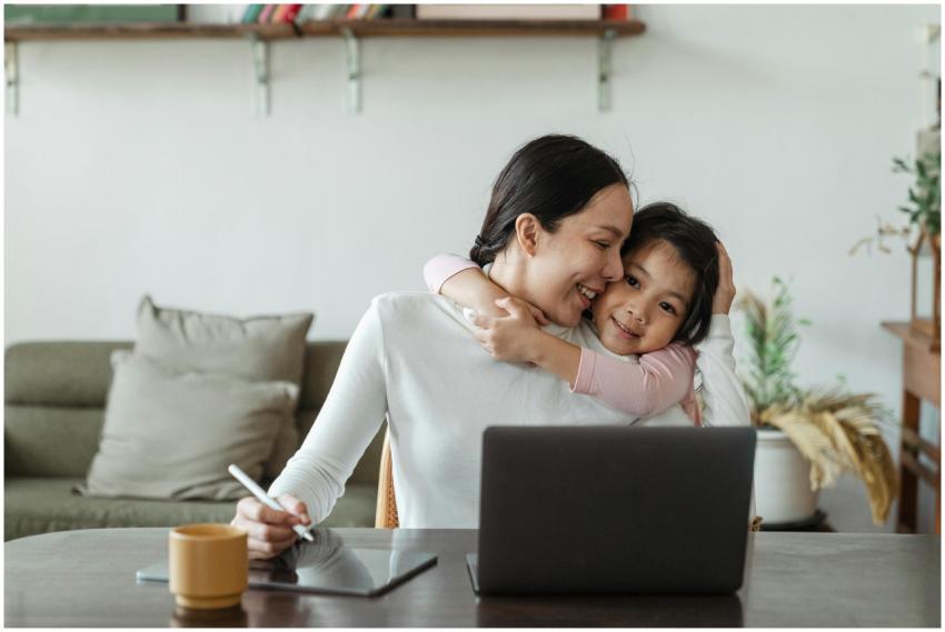 Happy young Asian woman working remotely from home