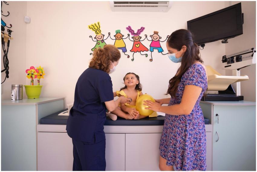 Doctor checks a young child at a pediatric clinic