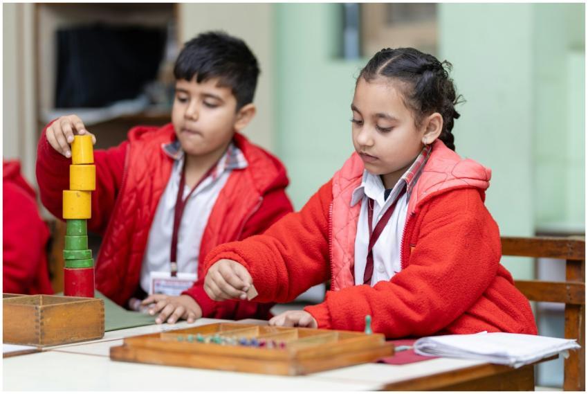 Two young children focus on educational activities