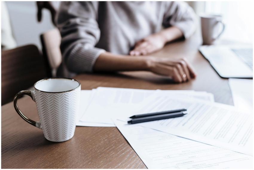 Close-up of a woman working from home, focusing on